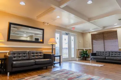 a living room with two couches and a flat screen tv at Legacy Vacation Resorts Kissimmee & Orlando - Near Disney in Kissimmee