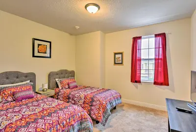 a bedroom with two beds and a window at 5 Mi to Disney Oasis with Pool and Patio in Orlando