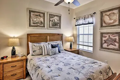 a bedroom with a bed and two lamps and a window at Kissimmee Retreat with Pool Access Less Than 4 Mi to Disney! in Orlando