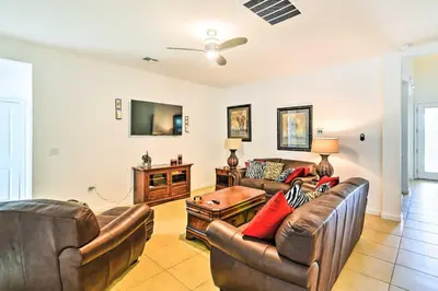 a living room with two couches and a tv at Home with Private Pool and Spa 8 Mi to Disney in Kissimmee