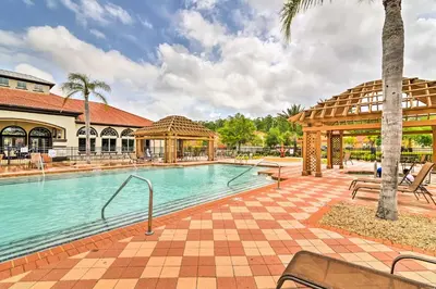 a swimming pool at a resort with a gazebo at Home with Private Pool and Spa 8 Mi to Disney in Kissimmee