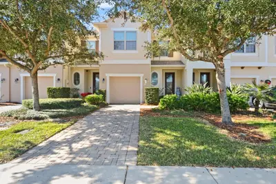 a house with trees and a driveway at 4 Mi to Dtwn Home with Pool Access in Sanford in Sanford