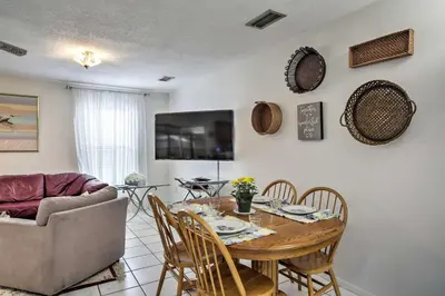 a living room with a table and a couch at Spacious Central Florida Home Family Friendly! in Orlando