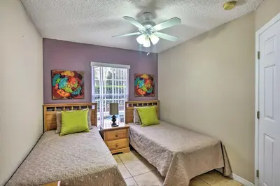 a bedroom with two beds and a ceiling fan at Clermont Home with Pool and Game Room 10 Mi to Parks! in Orlando