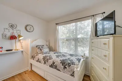 a bedroom with a bed and a window at Spacious Home in Gated Resort, 2 Mi to Disney! in Orlando