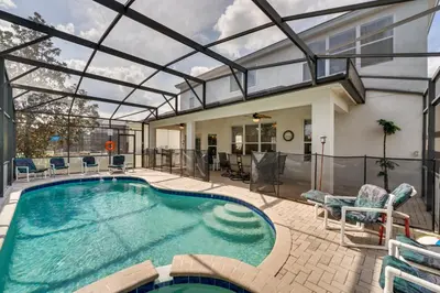 an indoor swimming pool with a glass ceiling at Spacious Home in Gated Resort, 2 Mi to Disney! in Orlando