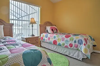 a bedroom with two beds and a window at Beautiful Kissimmee Home - 5 Mi to Disney World! in Kissimmee