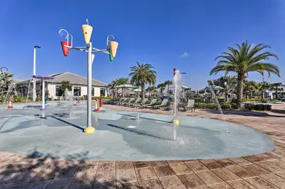 a playground with water fountains in a park at about 6 Mi to Disney Kissimmee Retreat with Pool! in Kissimmee