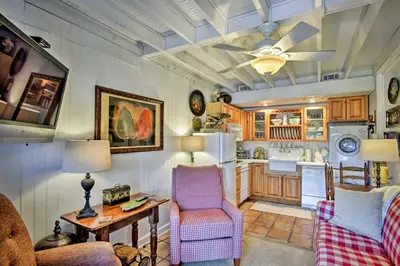 a kitchen with a ceiling fan and a table and chairs at Lake Marion Apt with Canoe in Altamonte Springs! in Orlando