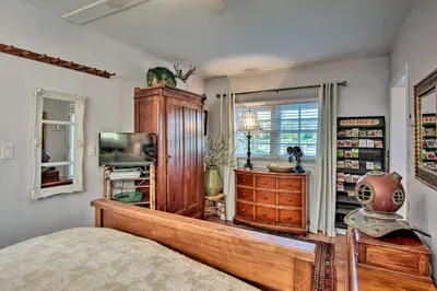 a bedroom with a bed and a tv in a room at Lake Marion Apt with Canoe in Altamonte Springs! in Orlando