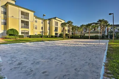 a basketball court in front of a building at Lake-View Condo with Pool Access 6 Mi to Disney! in Kissimmee
