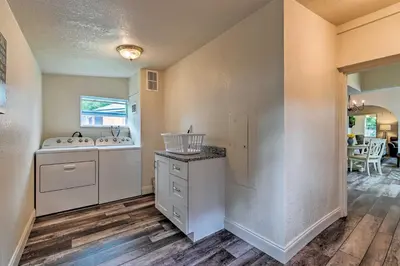a kitchen with two sinks and a counter at Walk to Dtwn Winter Garden Home with Patio in Orlando