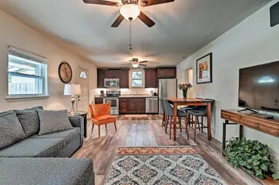 a living room with a couch and a table at Walkable Winter Garden Bungalow 3 Blocks to Dtwn in Orlando