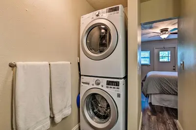 a laundry room with a washer and dryer at Walkable Winter Garden Bungalow 3 Blocks to Dtwn in Orlando