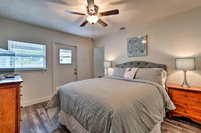 a bedroom with a bed and a ceiling fan at Walkable Winter Garden Bungalow 3 Blocks to Dtwn in Orlando