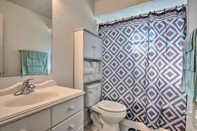 a bathroom with a toilet and a sink and a shower at Kissimmee Home 5 Mi to Gatorland and 15 Mi to Disney in Kissimmee
