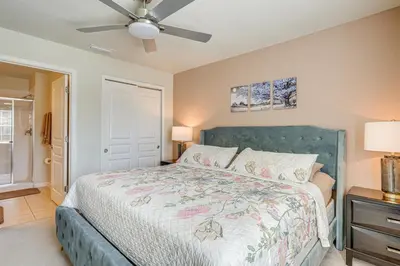 a bedroom with a bed and a ceiling fan at 3 Mi to WDW Windsor Hills Home with Game Room! in Orlando