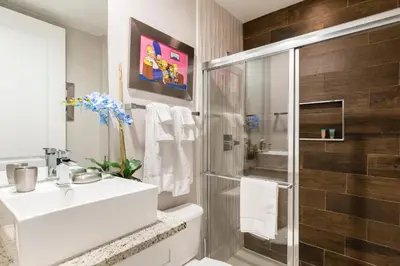 a bathroom with a white sink and a shower at 5min Disney Fantastic Family Villa SMV113 in Orlando