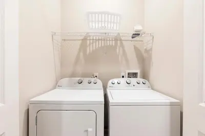 a kitchen with two white appliances in a room at 5min Disney Fantastic Family Villa SMV113 in Orlando