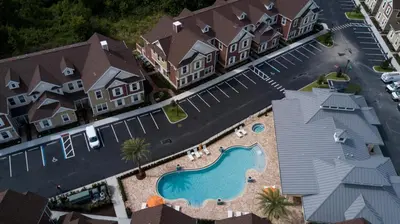 an aerial view of a house with a swimming pool at Amazing Family Villa 5min Disney w BBQ 128 in Orlando