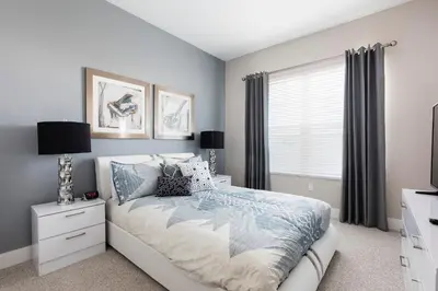 a bedroom with a bed and a window at Precious Townhome w BBQ 131 in Orlando