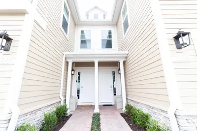 a white house with a white door at Amazing Family Villa, 5min Disney SMV144 in Orlando