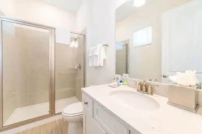 a bathroom with a shower and a sink and a toilet at Seashell Shore! Near Disney With Margaritaville Resort & Island H2O Access - 8048Ls in Orlando