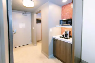 a small kitchen with a counter and a microwave at Hilton Garden Inn Winter Park, FL in Orlando