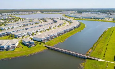 an aerial view of a resort next to a river at Marvelous 2 Bd Apt Close to Disney at Storey Lake 106 in Kissimmee
