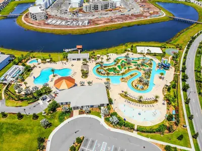 an aerial view of a pool at an amusement park at Fabulous Thematic 2BR Condo with Kids Splash Pad in Kissimmee