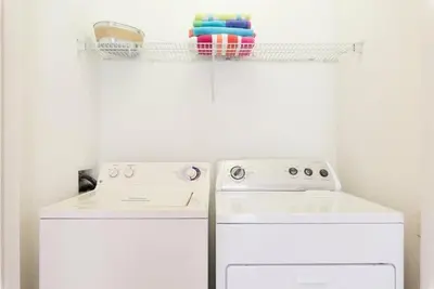 a kitchen with a white stove and a dishwasher at Beautiful Condo - Windsor Hills - 2 Miles Disney in Orlando
