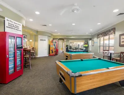 a billiard room with two pool tables and a bar at Beautiful Condo - Windsor Hills - 2 Miles Disney in Orlando