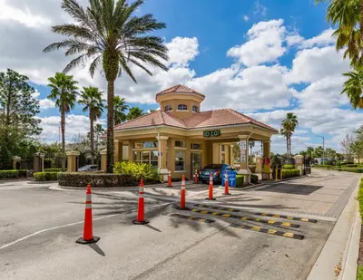 a building with orange cones in the street at Beautiful Condo - Windsor Hills - 2 Miles Disney in Orlando