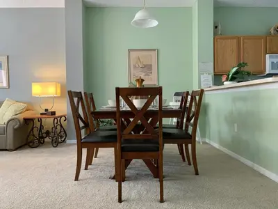 a dining room table and chairs in a room at Terra Verde Vacation Rentals in Kissimmee