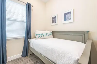 a bedroom with a bed and a window at Sandy Shores Cottage Near Disney With Margaritaville Resort & Island H2O Access - 8077Kd in Orlando