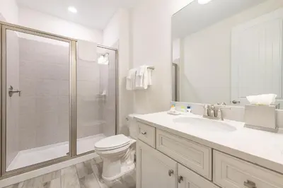 a bathroom with a shower and a toilet and a sink at The Island Life! Near Disney With Margaritaville Resort & Island H2O Access - 8055Kd in Orlando