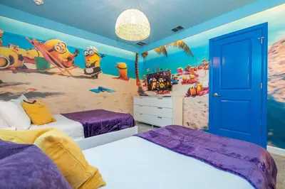 a bedroom with two beds and a beach mural at 2911 Fable Street in Kissimmee