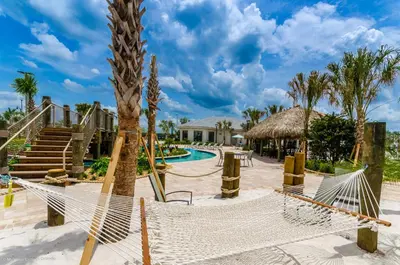 a resort with a hammock and a swimming pool at 4814 Lullaby Lane in Kissimmee