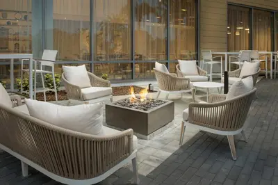 a patio with chairs and a fire pit at Element Orlando Universal Blvd. in Orlando
