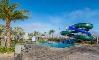a water slide in a resort with a pool at 4975AN TOWNHOUSE 5 BEDROOMS & 4 BATHROOMS + POOL in Kissimmee