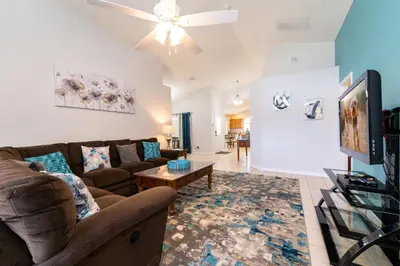 a living room with a couch and a table at 16150EGRET- Sun Chaser (S) in Orlando