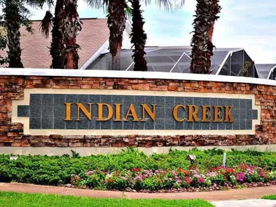 a sign for an indian creek sign in front of a building at 2685OL - Jagu Deaux (G) in Kissimmee