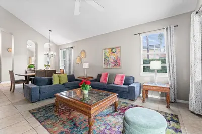 a living room with blue couches and a table at 1323ZUREIQ-Zureiq Dreams (S) in Orlando