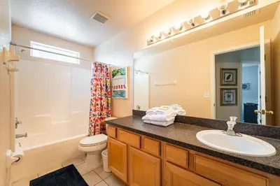 a bathroom with a sink and a toilet at 1323ZUREIQ-Zureiq Dreams (S) in Orlando