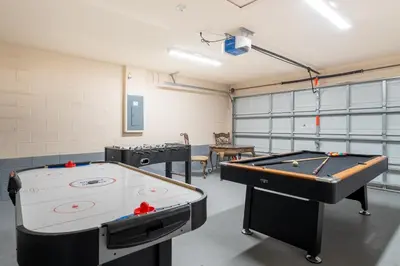 two ping pong tables in a ping pong room at 1323ZUREIQ-Zureiq Dreams (S) in Orlando