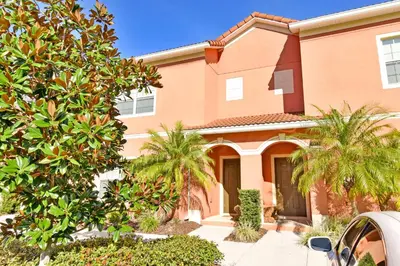 a house with palm trees in front of it at 8975CPR - Waites Home (G) in Kissimmee