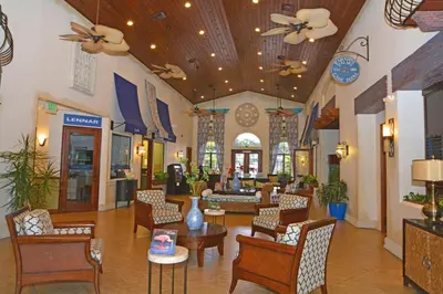 a lobby of a hotel with tables and chairs at 8975CPR - Waites Home (G) in Kissimmee