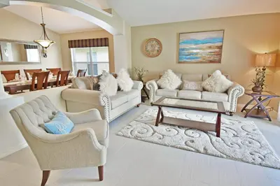 a living room with two couches and a table at 4639EPD - Comfort Island (G) in Kissimmee