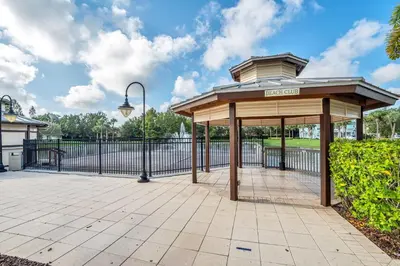 a pavilion in a park with a fence at 2 Bedroom Vacation Condo 2011 in Kissimmee