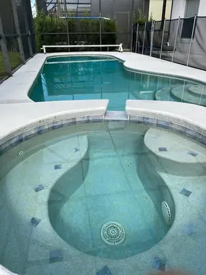 a swimming pool with blue water in a building at Platinum Vacation Homes of Orlando in Orlando